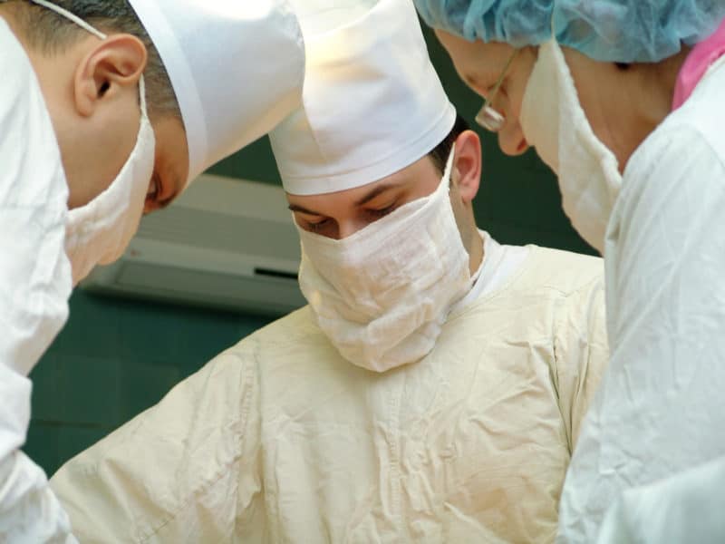 three surgeons do operation