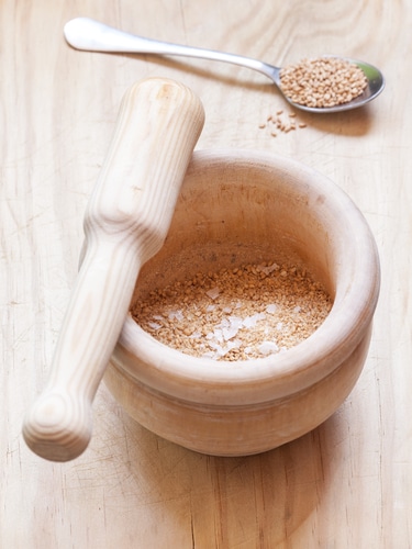 Close-up view of organic Gomasio in a ceramic bowl